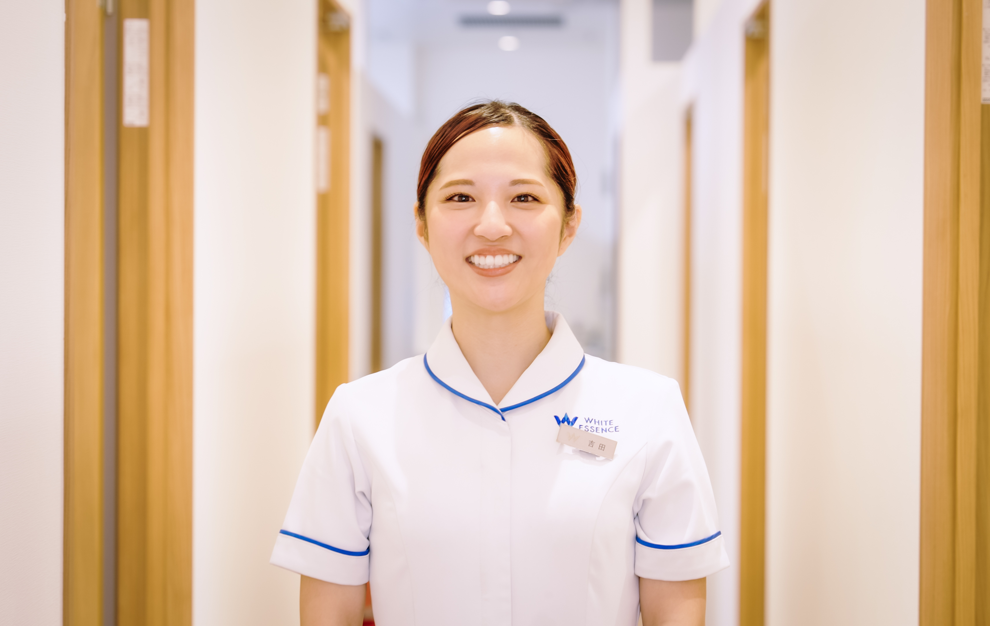 Staff member smiling in hallway